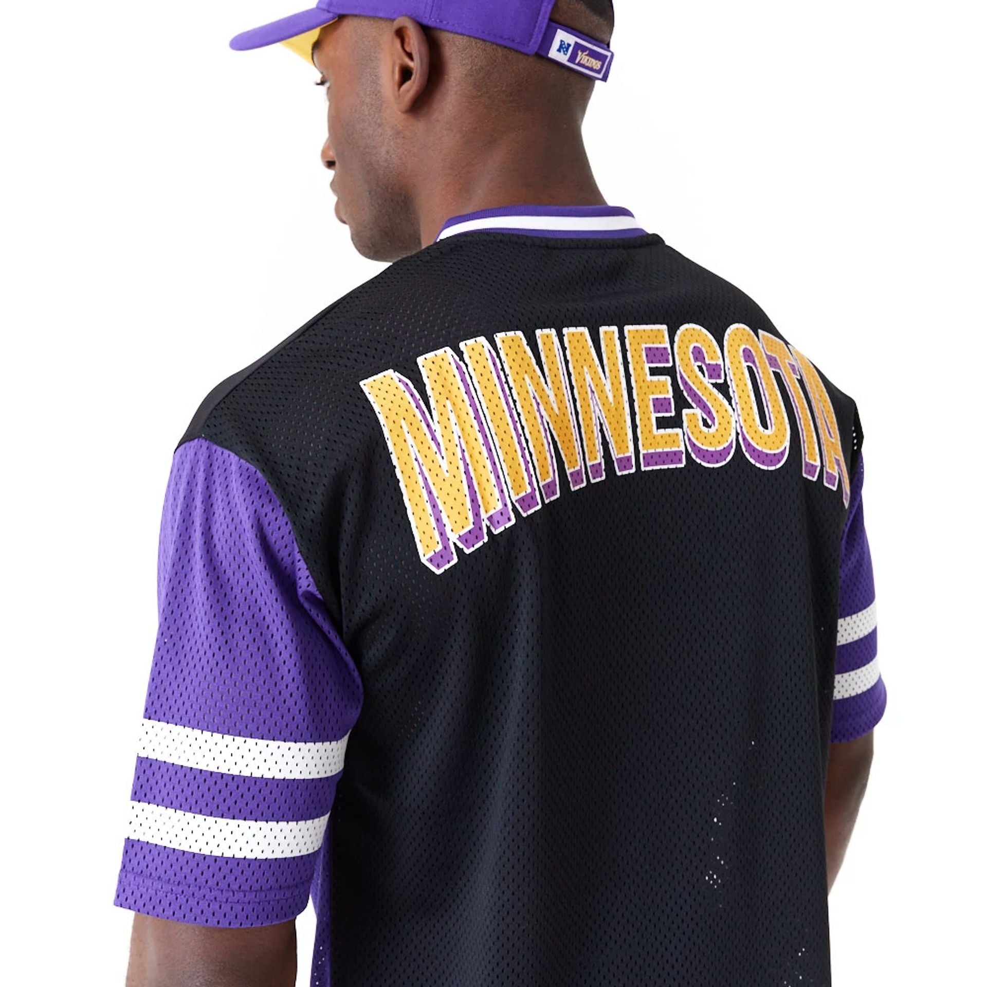 The Male model is wearing Minnesota Vikings NFL Wordmark Graphic Purple T-Shirt 2