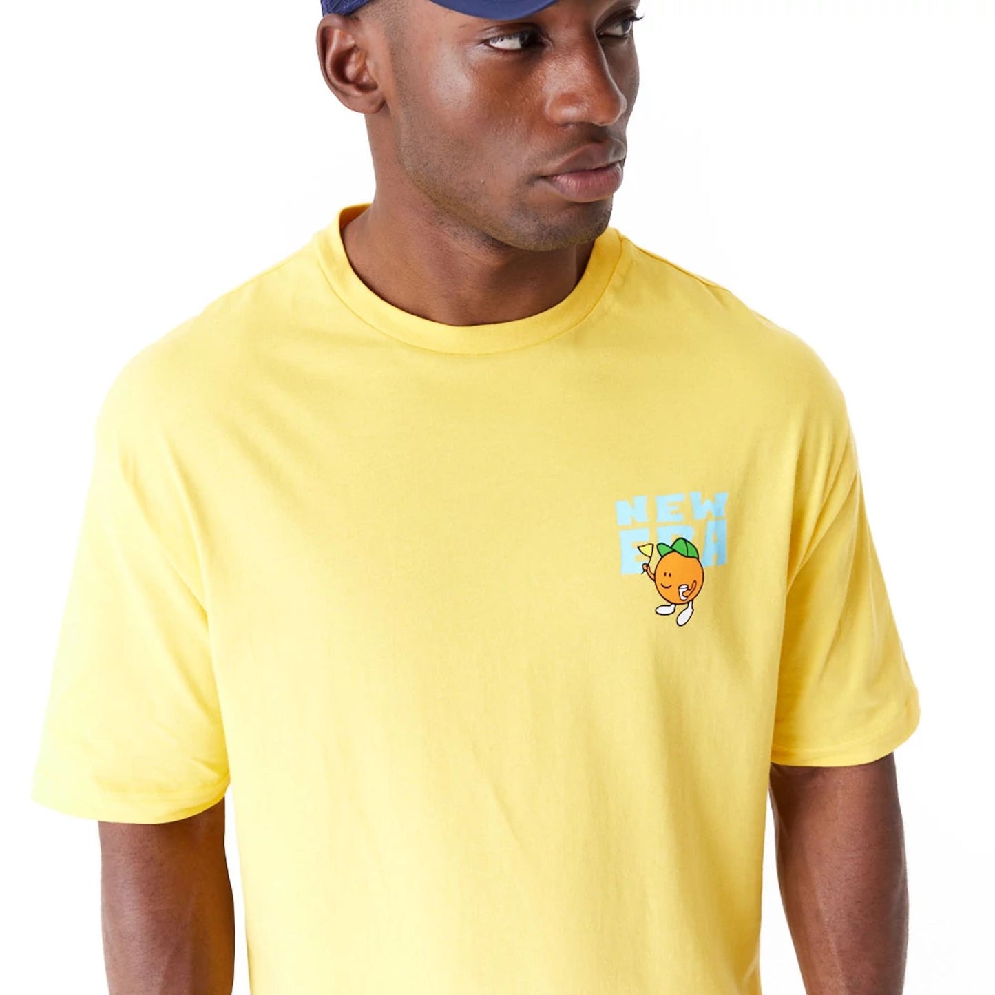 The Male model is wearing New Era Pool Party Fruit Graphic Yellow Oversized T-Shirt 5