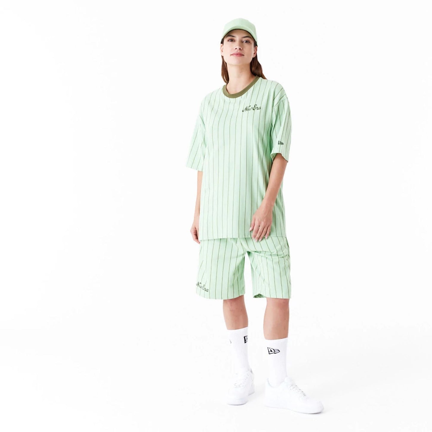 The Male model is wearing New Era Pinstripe Bright Green Oversized T-Shirt 3