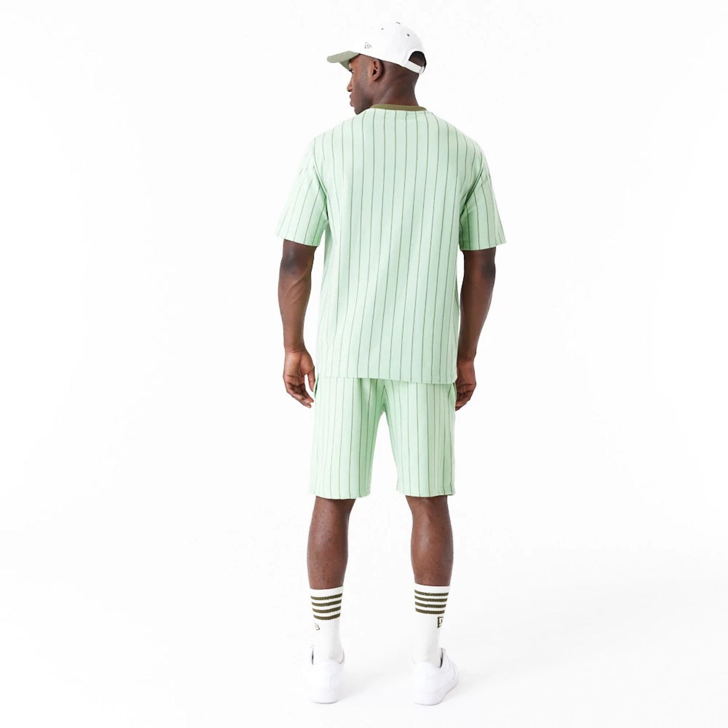 The Male model is wearing New Era Pinstripe Bright Green Oversized T-Shirt 2