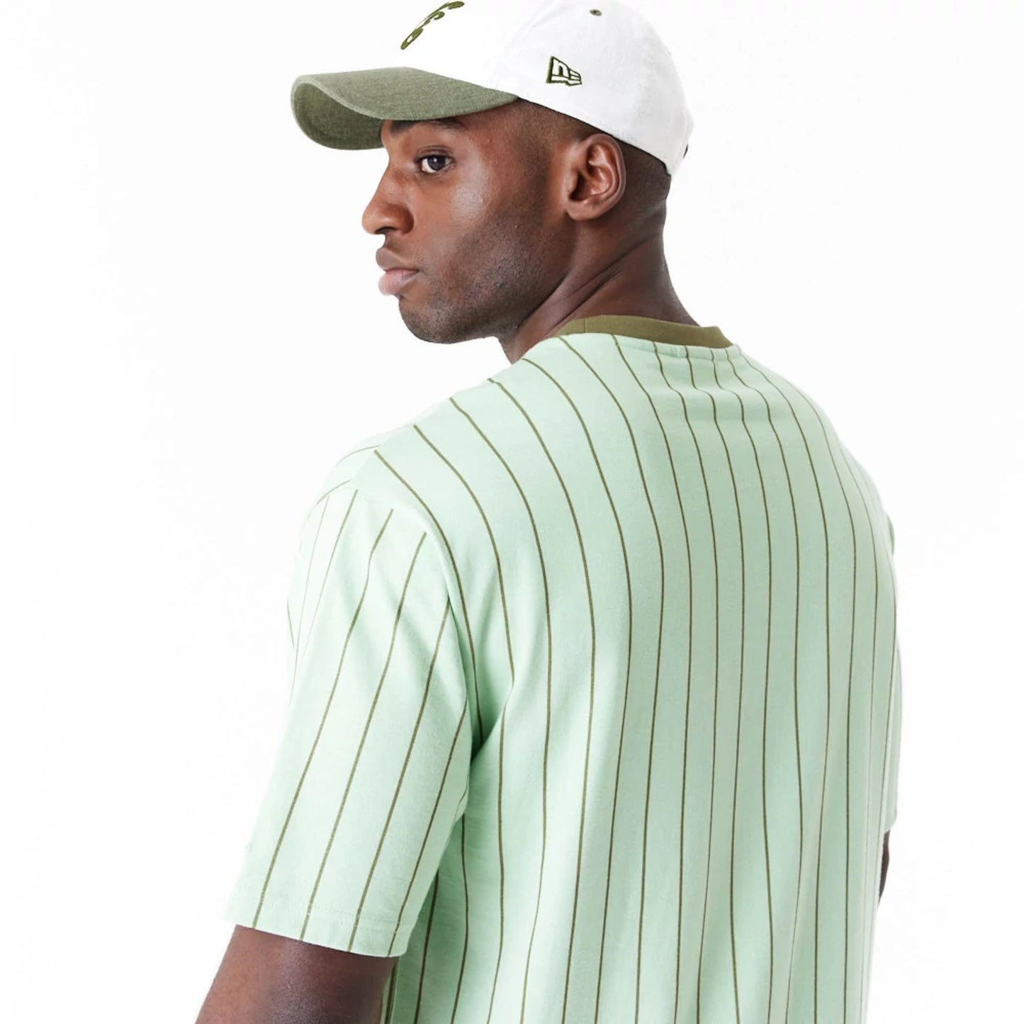 The Male model is wearing New Era Pinstripe Bright Green Oversized T-Shirt 10