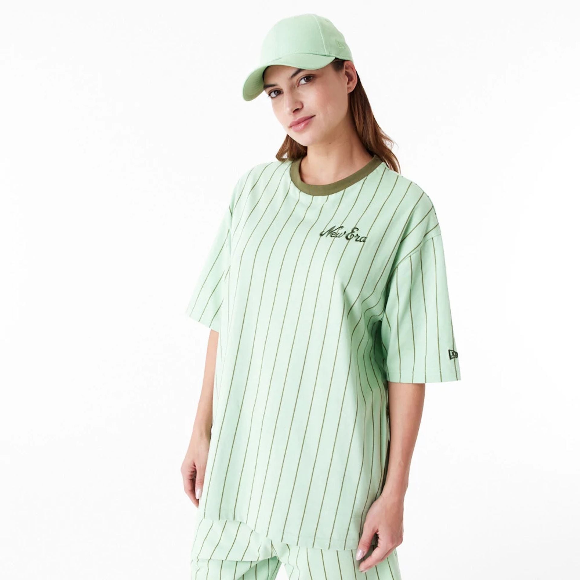 The Male model is wearing New Era Pinstripe Bright Green Oversized T-Shirt 11