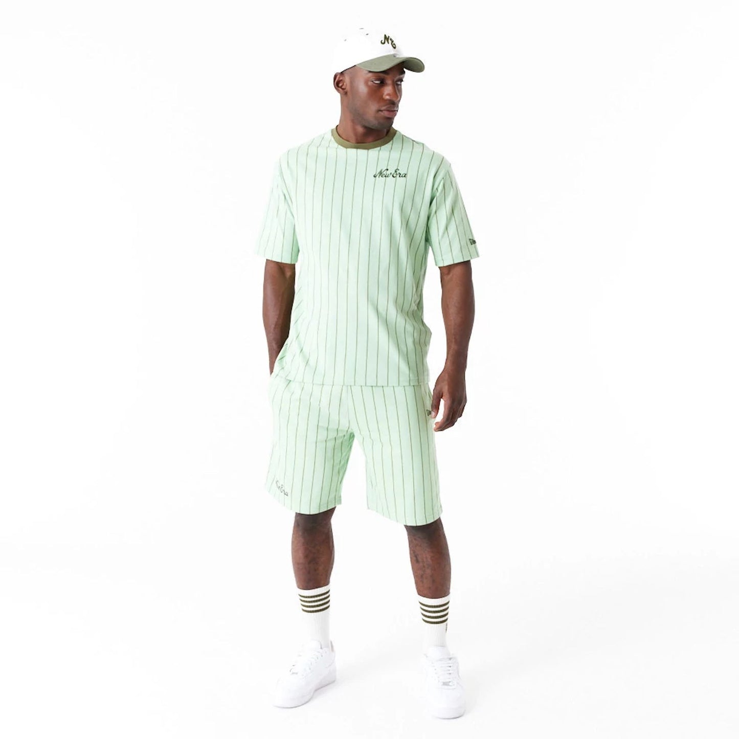 The Male model is wearing New Era Pinstripe Bright Green Oversized T-Shirt 4