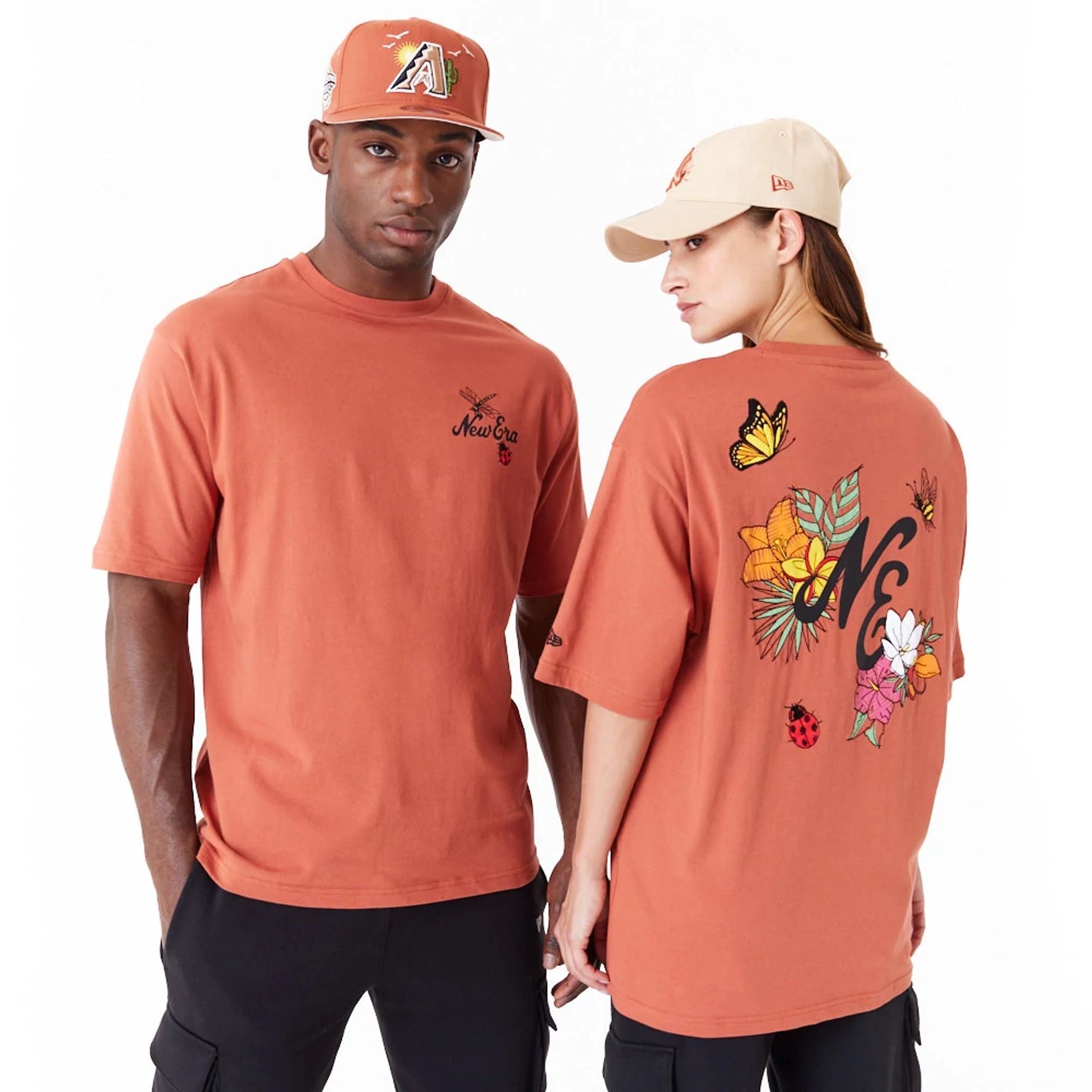 The Male model is wearing New Era Floral Graphic Brown Oversized T-Shirt 1