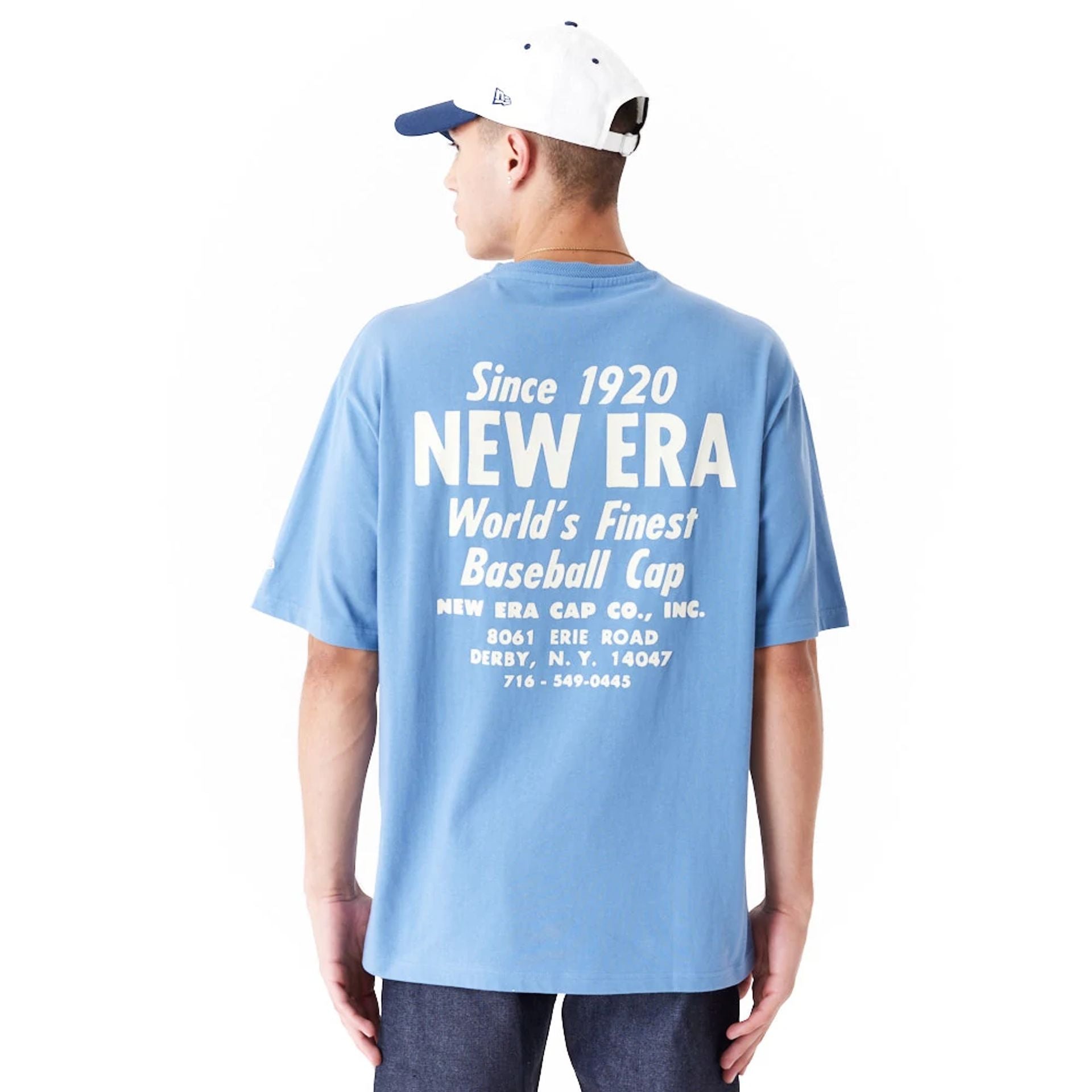 The Male model is wearing New Era Graphic Blue Oversized T-Shirt 1