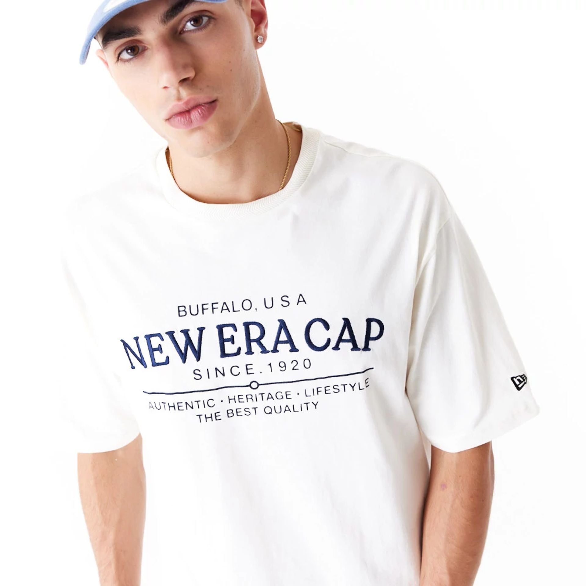 The Male model is wearing New Era Graphic White Oversized T-Shirt 2