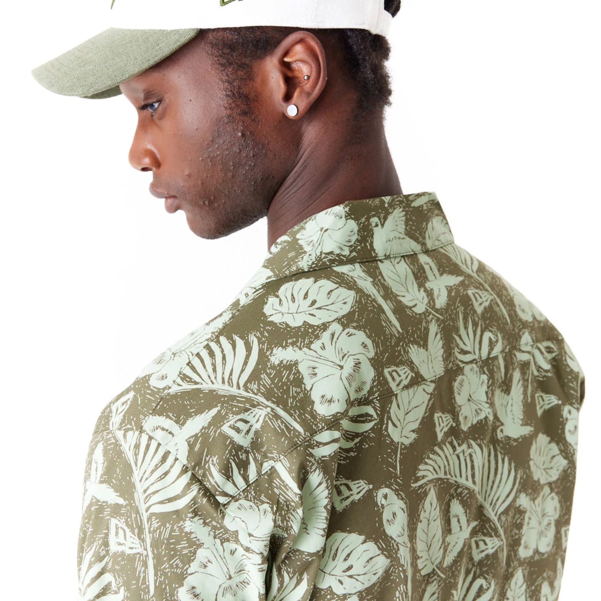 The Male model is wearing New Era All Over Print Green Woven Short Sleeve Shirt 3