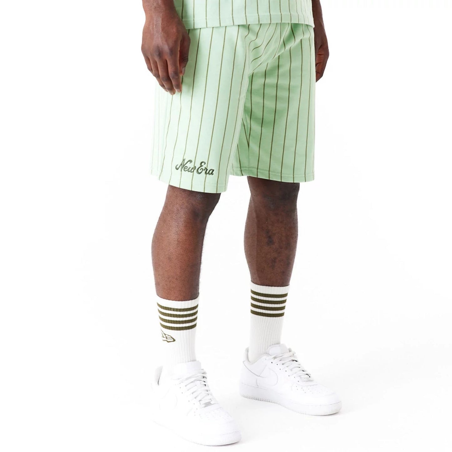 The Male model is wearing New Era Pinstripe Bright Green Shorts 9