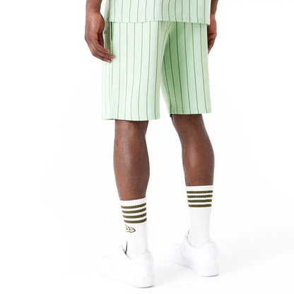 The Male model is wearing New Era Pinstripe Bright Green Shorts 2