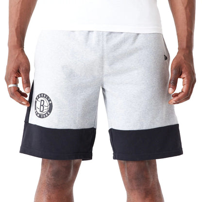 The Male model is wearing Brooklyn Nets NBA Colour Block Grey Shorts 5