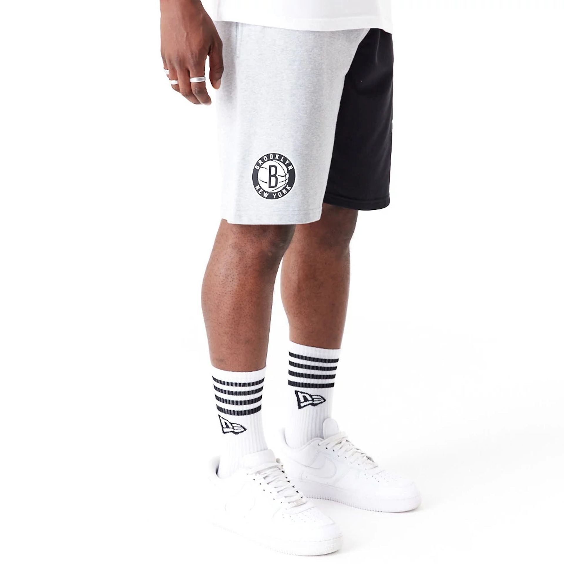 The Male model is wearing Brooklyn Nets NBA Graphic Grey Shorts 8