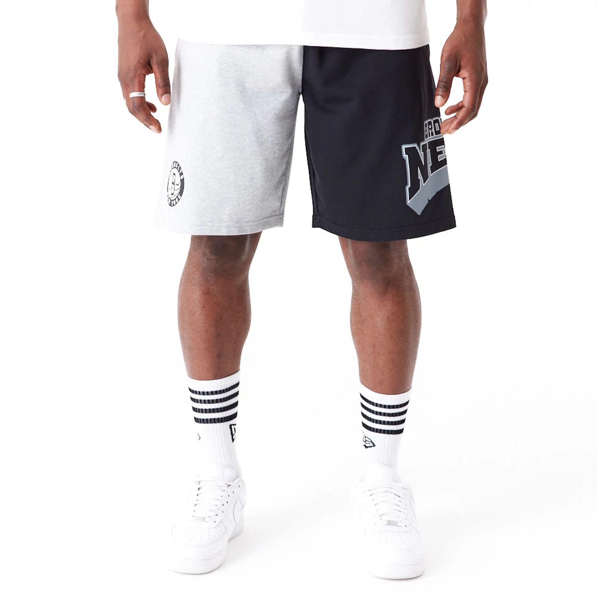 The Male model is wearing Brooklyn Nets NBA Graphic Grey Shorts 5