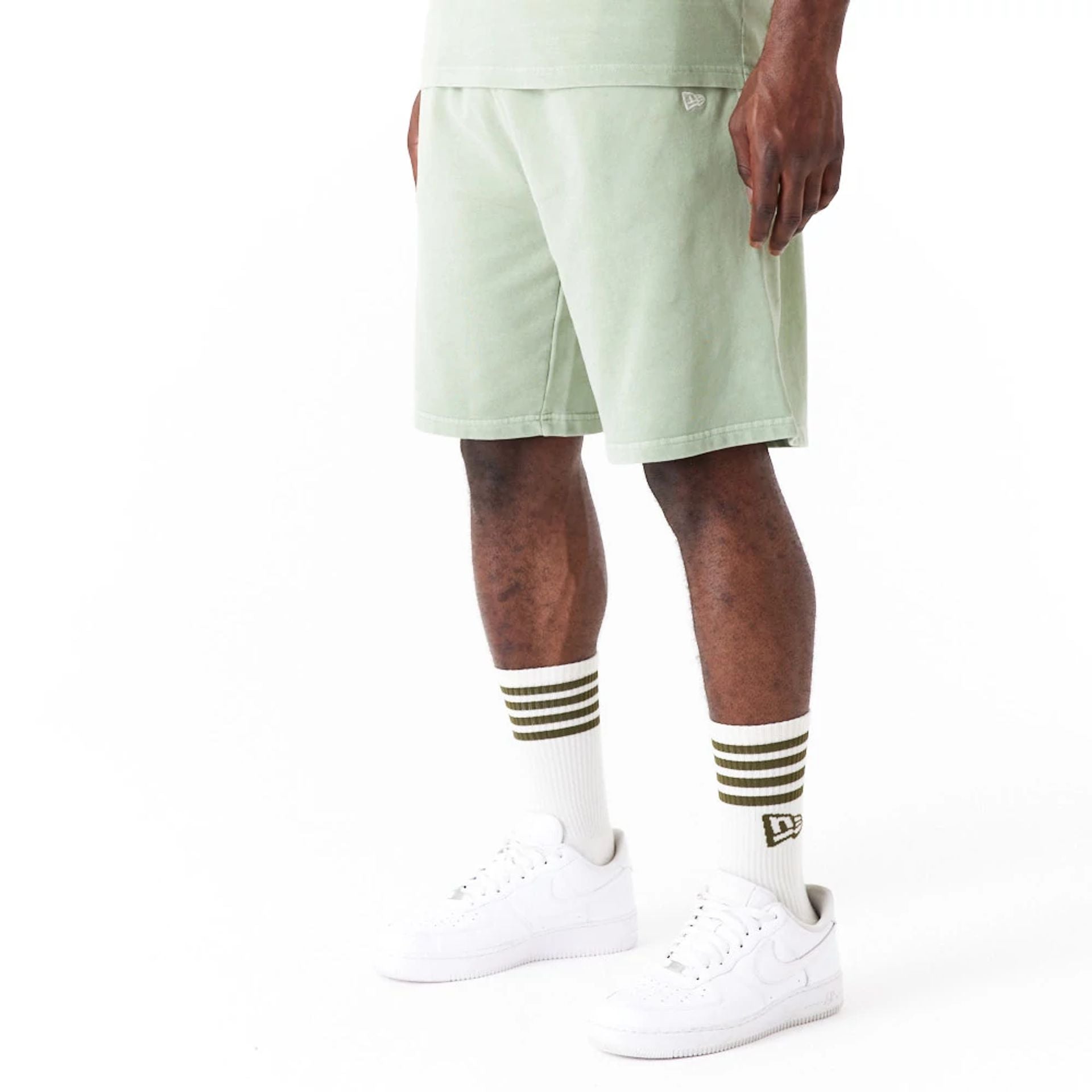 The Male model is wearing New Era Washed Green Shorts 2