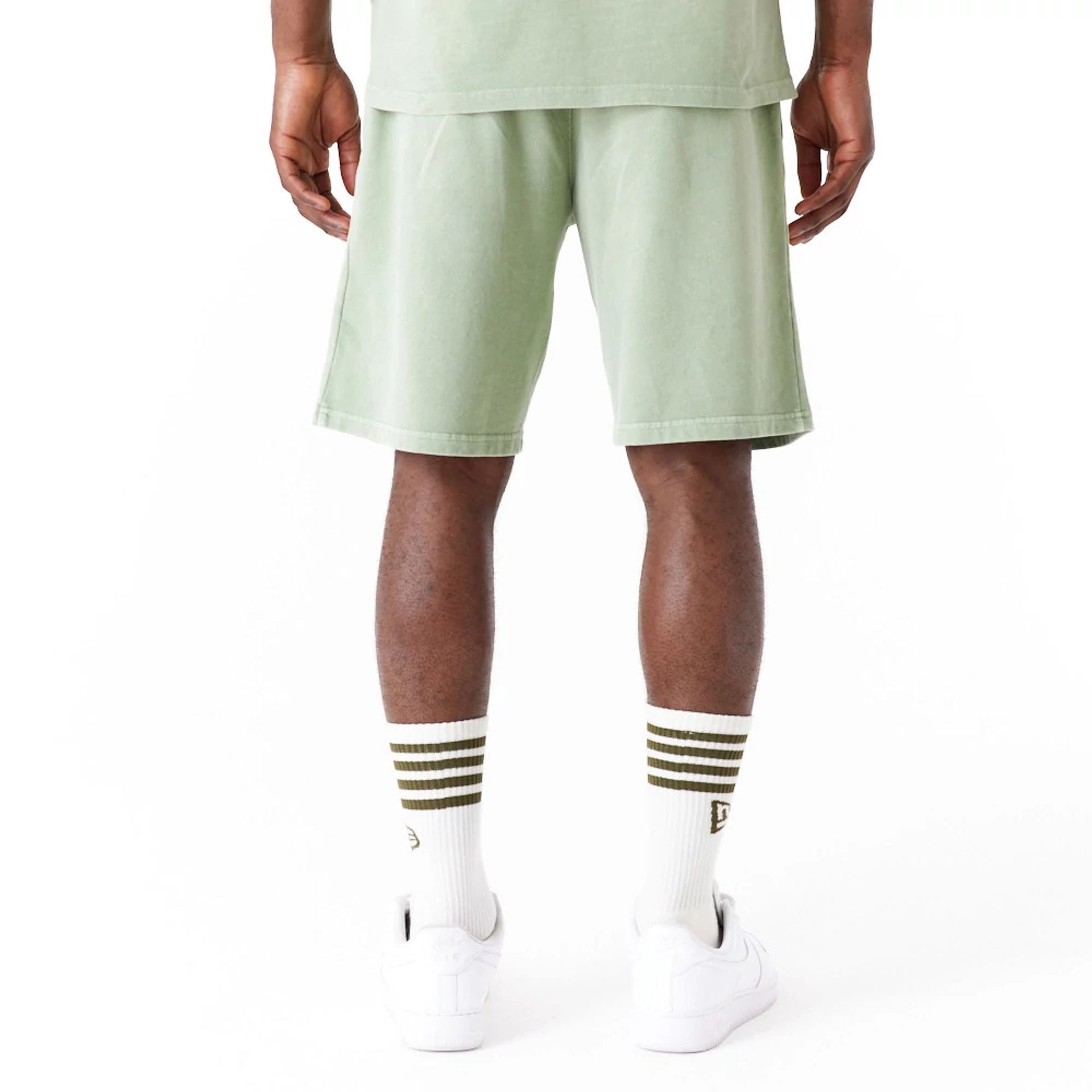 The Male model is wearing New Era Washed Green Shorts 5