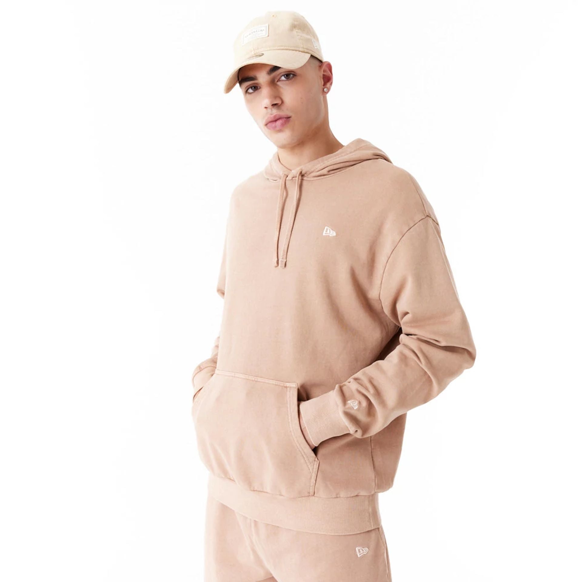 The Male model is wearing New Era Washed Orange Oversized Pullover Hoodie 10