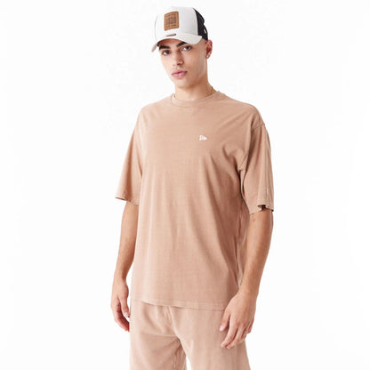 The Male model is wearing New Era Washed Orange Oversized T-Shirt 2