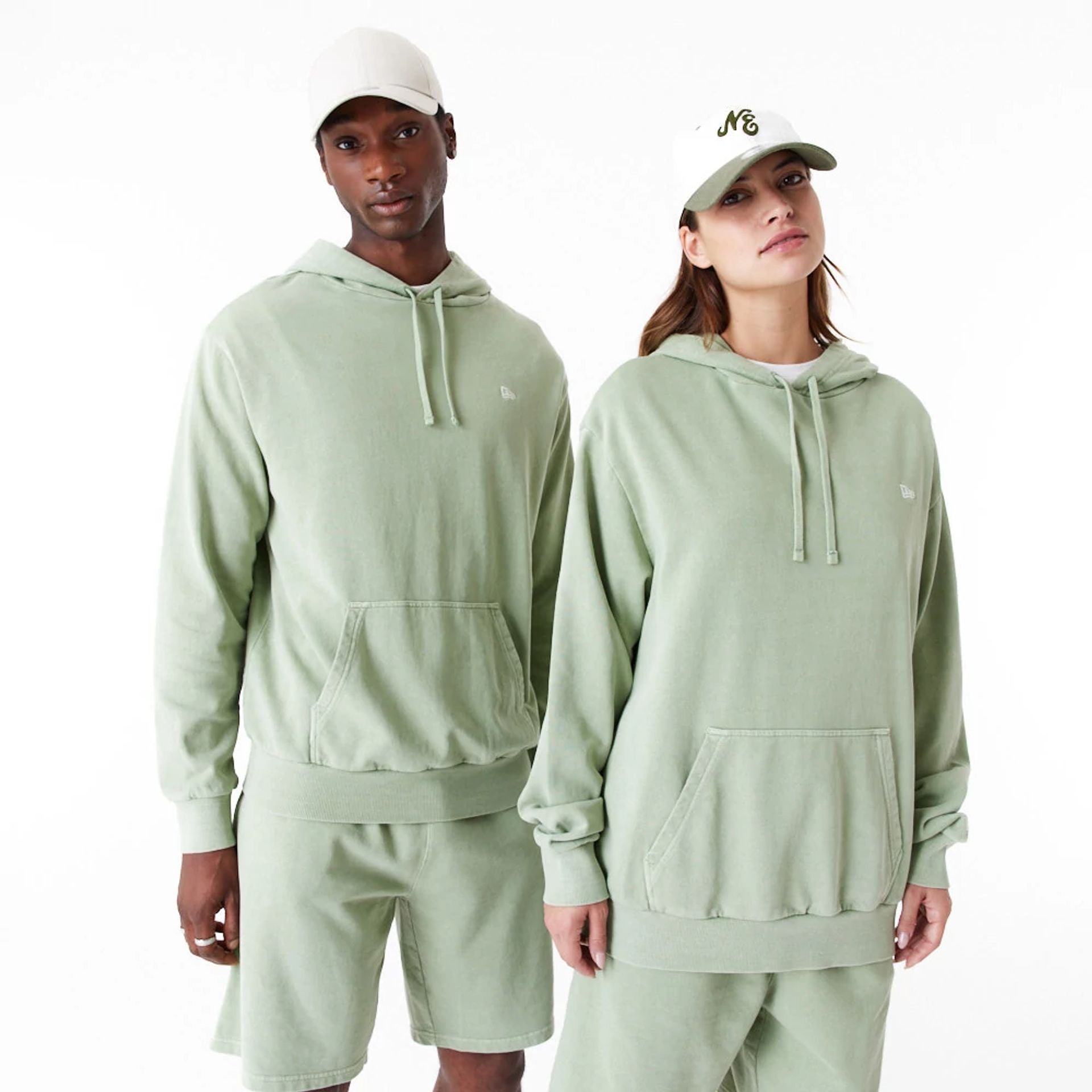 The Male model is wearing New Era Washed Green Oversized Pullover Hoodie 1