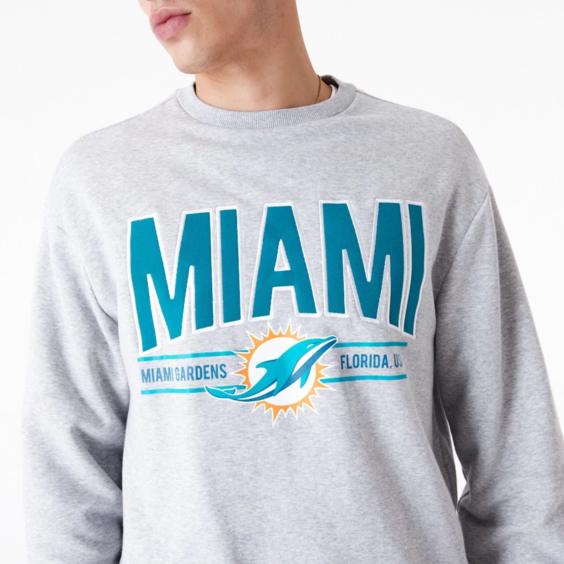 The Male model is wearing Miami Dolphins NFL Wordmark Grey Oversized Crew Neck Sweatshirt 4