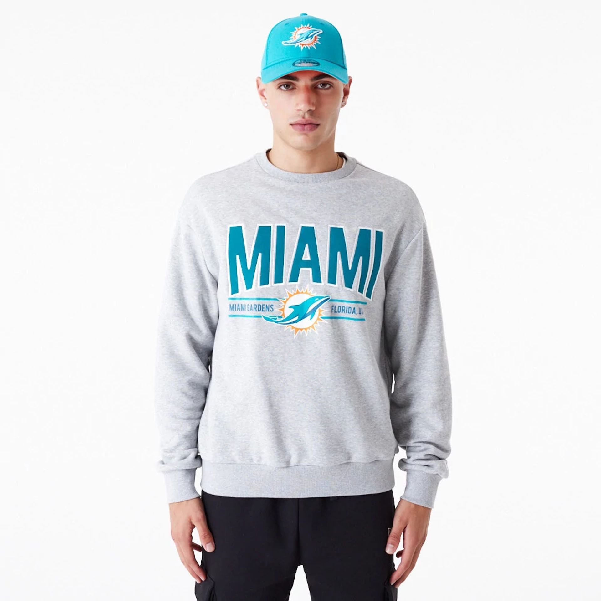 The Male model is wearing Miami Dolphins NFL Wordmark Grey Oversized Crew Neck Sweatshirt 1