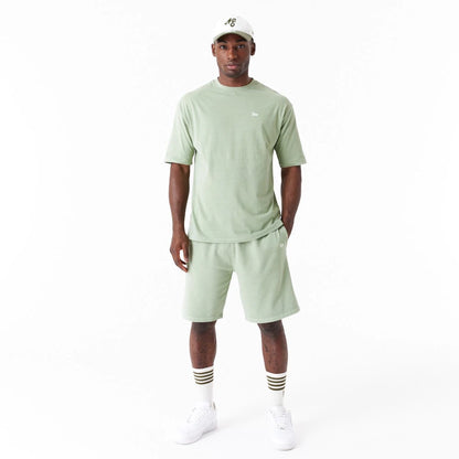 The Male model is wearing New Era Washed Green Oversized T-Shirt 7