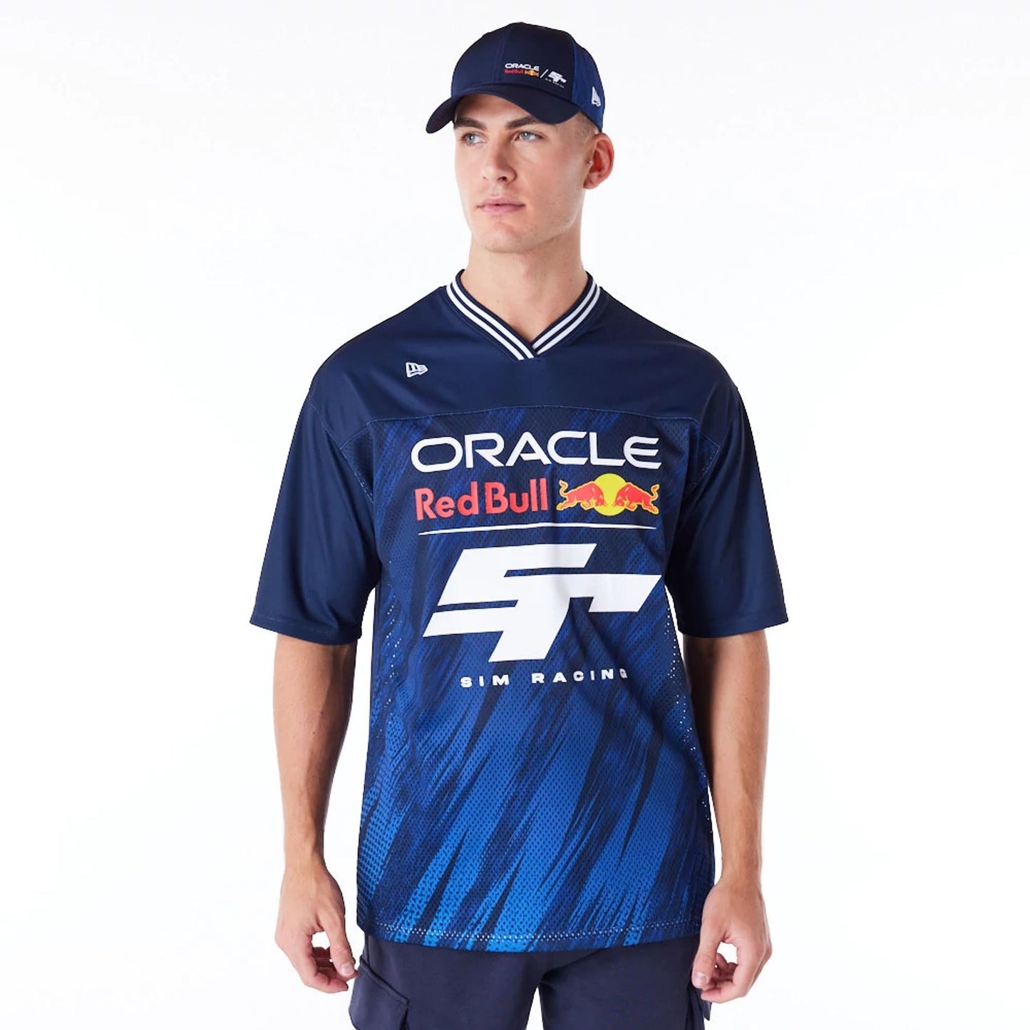 The Male model is wearing Red Bull  Sim Racing Navy V Neck Jersey 1