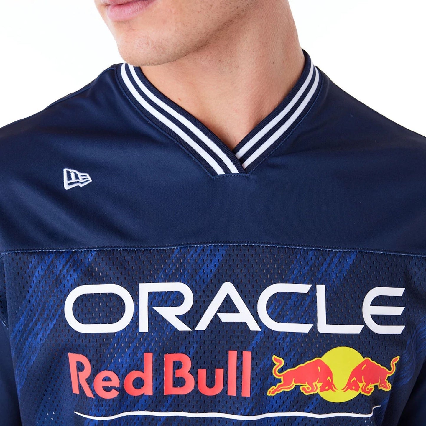 The Male model is wearing Red Bull  Sim Racing Navy V Neck Jersey 3