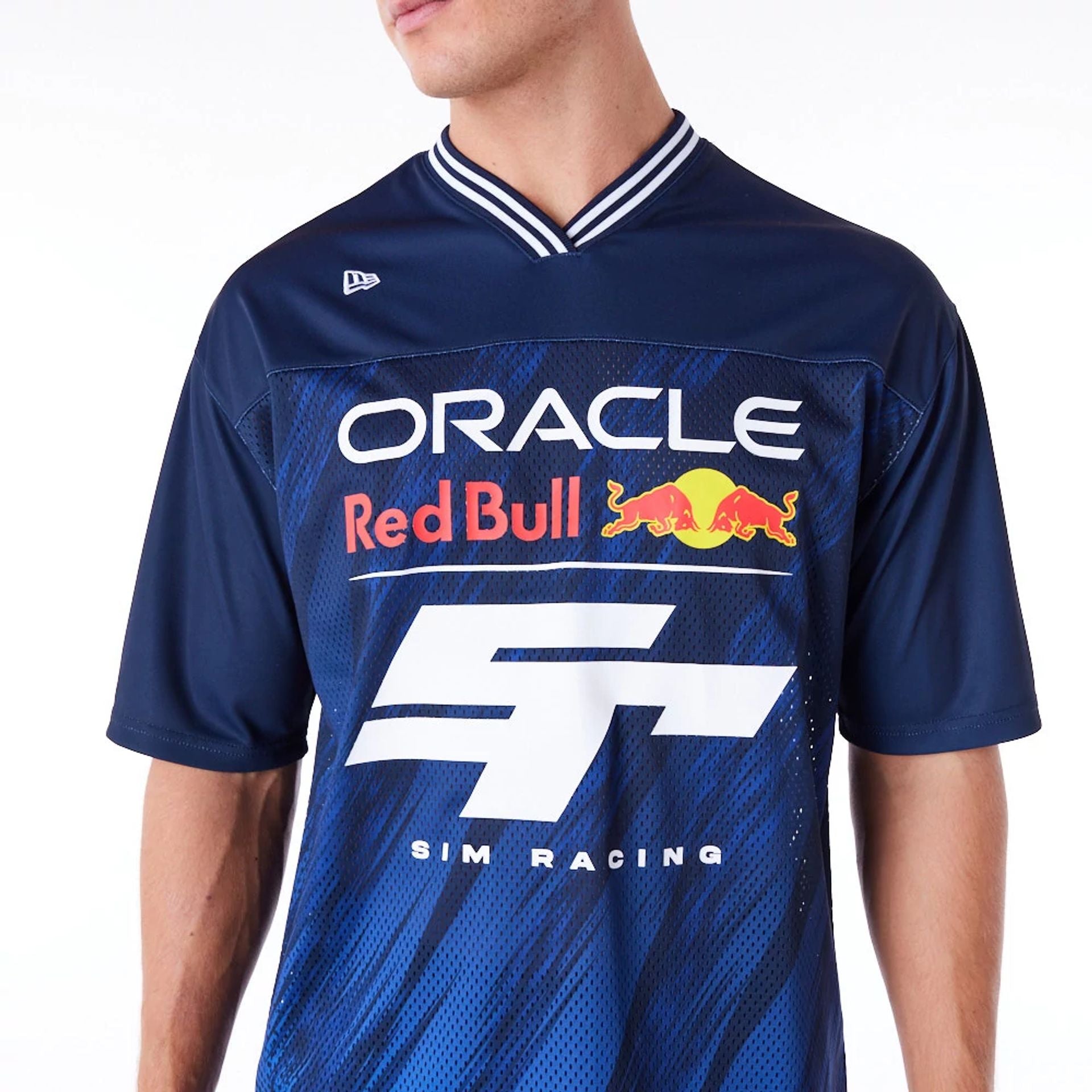 The Male model is wearing Red Bull  Sim Racing Navy V Neck Jersey 4