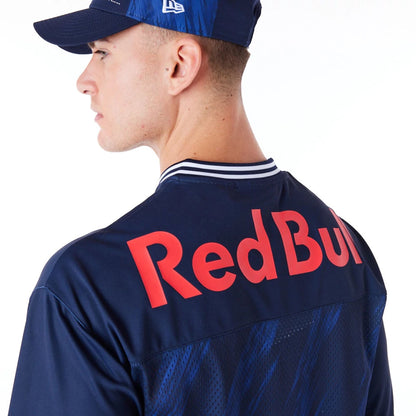 The Male model is wearing Red Bull  Sim Racing Navy V Neck Jersey 5