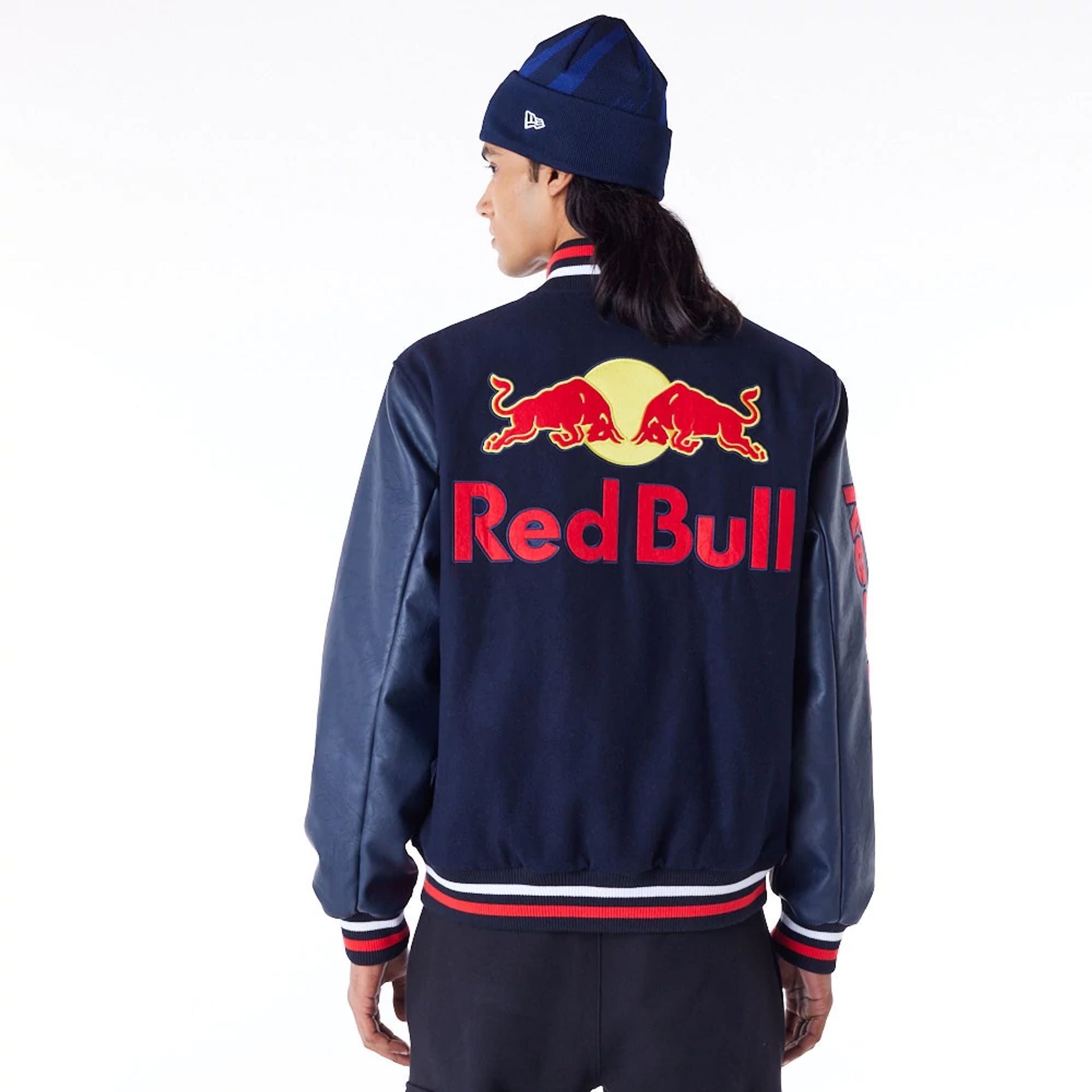 The Male model is wearing Red Bull Sim Racing Navy Varsity Jacket 2