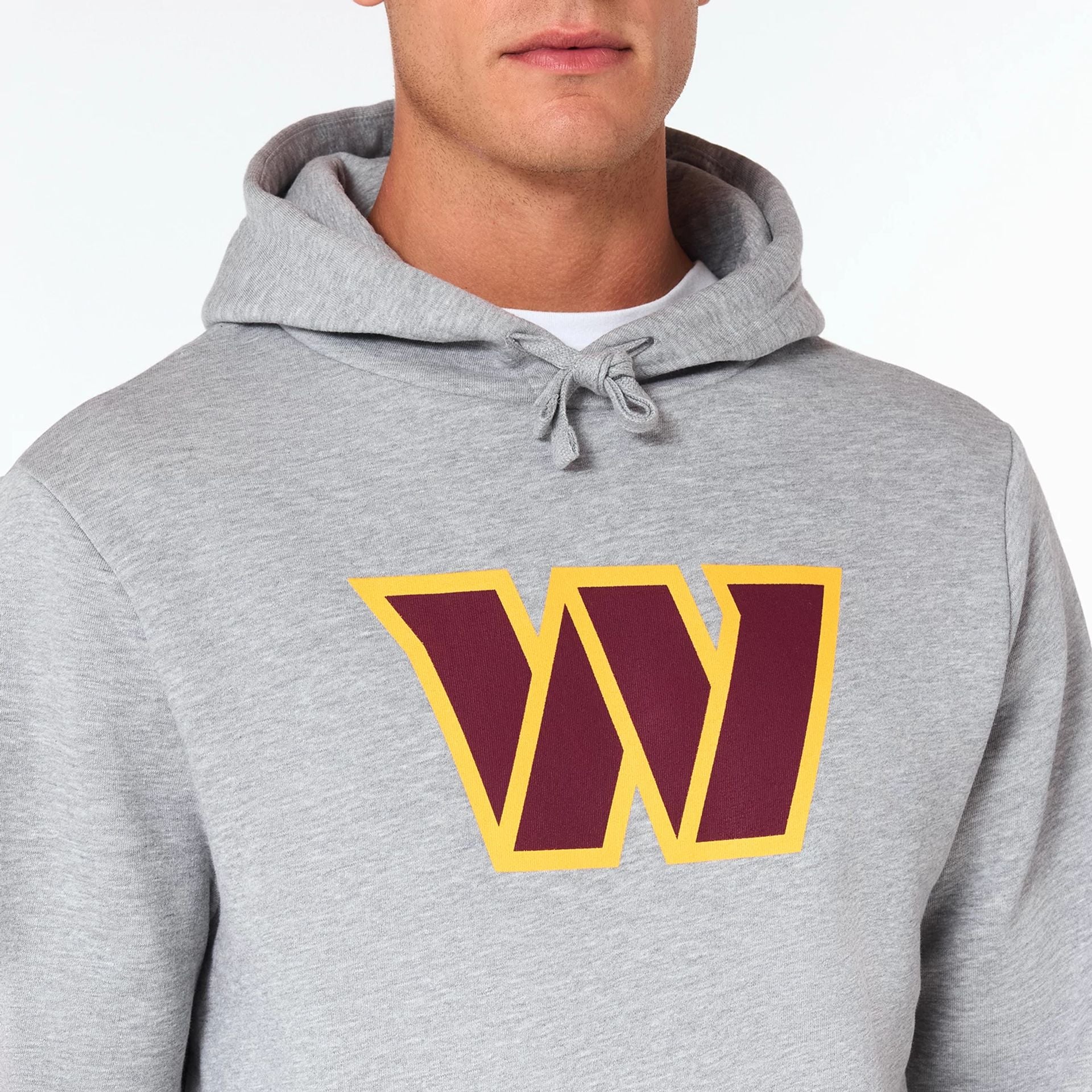 The Male model is wearing Washington Commanders NFL Grey Pullover Hoodie 2