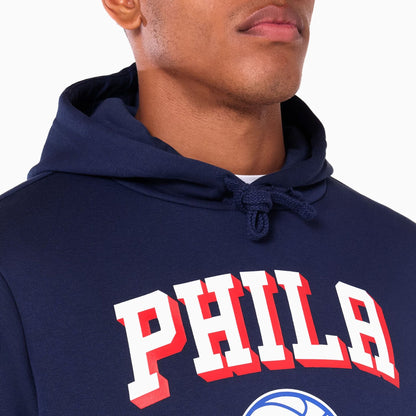 The Male model is wearing Philadelphia 76ers NBA Navy Pullover Hoodie 2