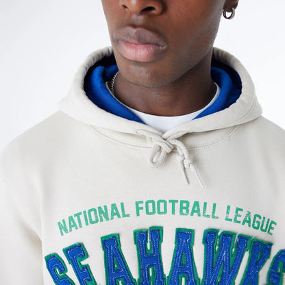 The Male model is wearing Seattle Seahawks NFL 3rd Down Historic Light Beige Pullover Hoodie  5