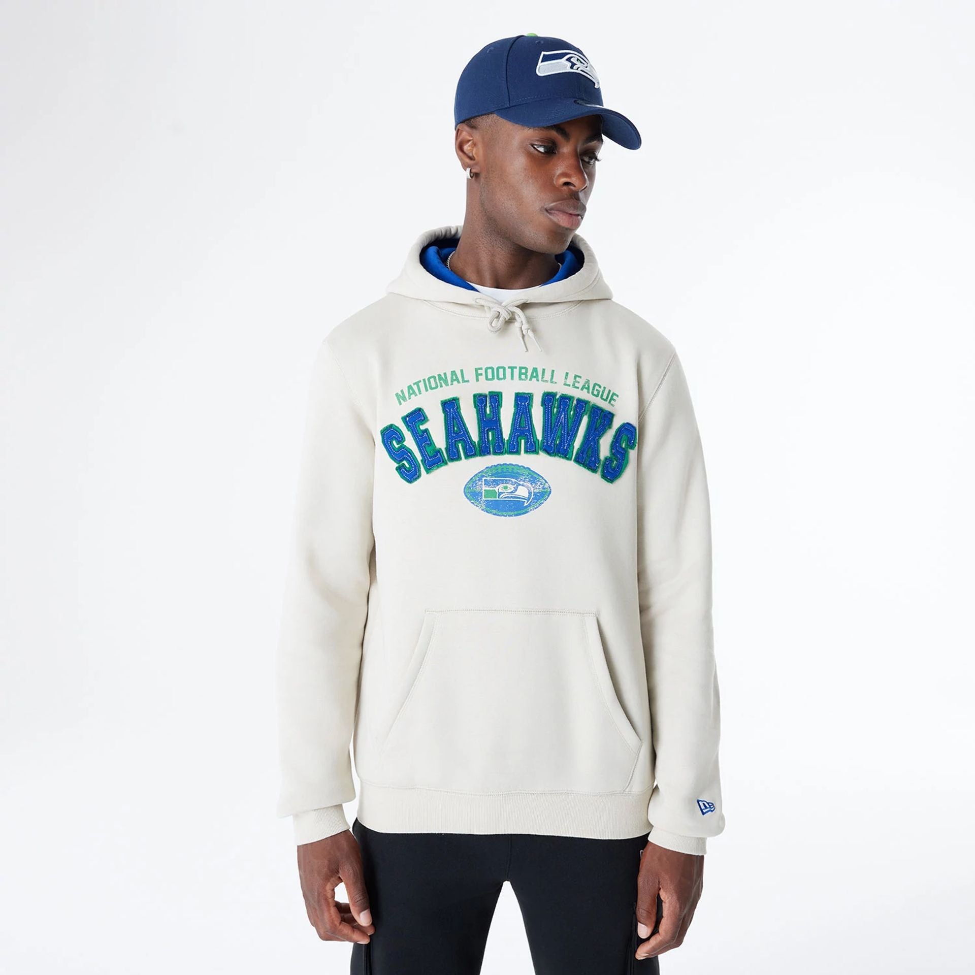 The Male model is wearing Seattle Seahawks NFL 3rd Down Historic Light Beige Pullover Hoodie  1