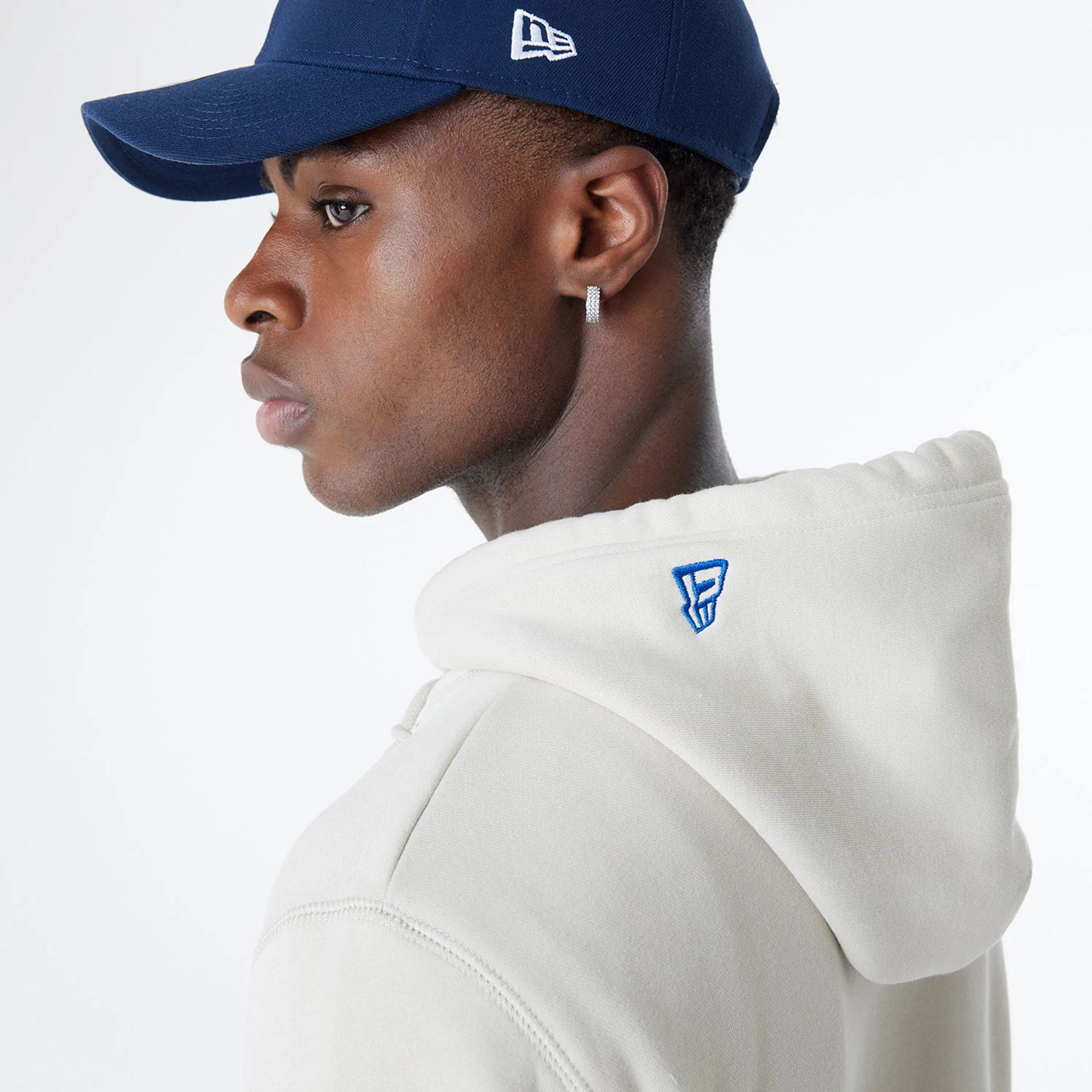 The Male model is wearing Seattle Seahawks NFL 3rd Down Historic Light Beige Pullover Hoodie  6