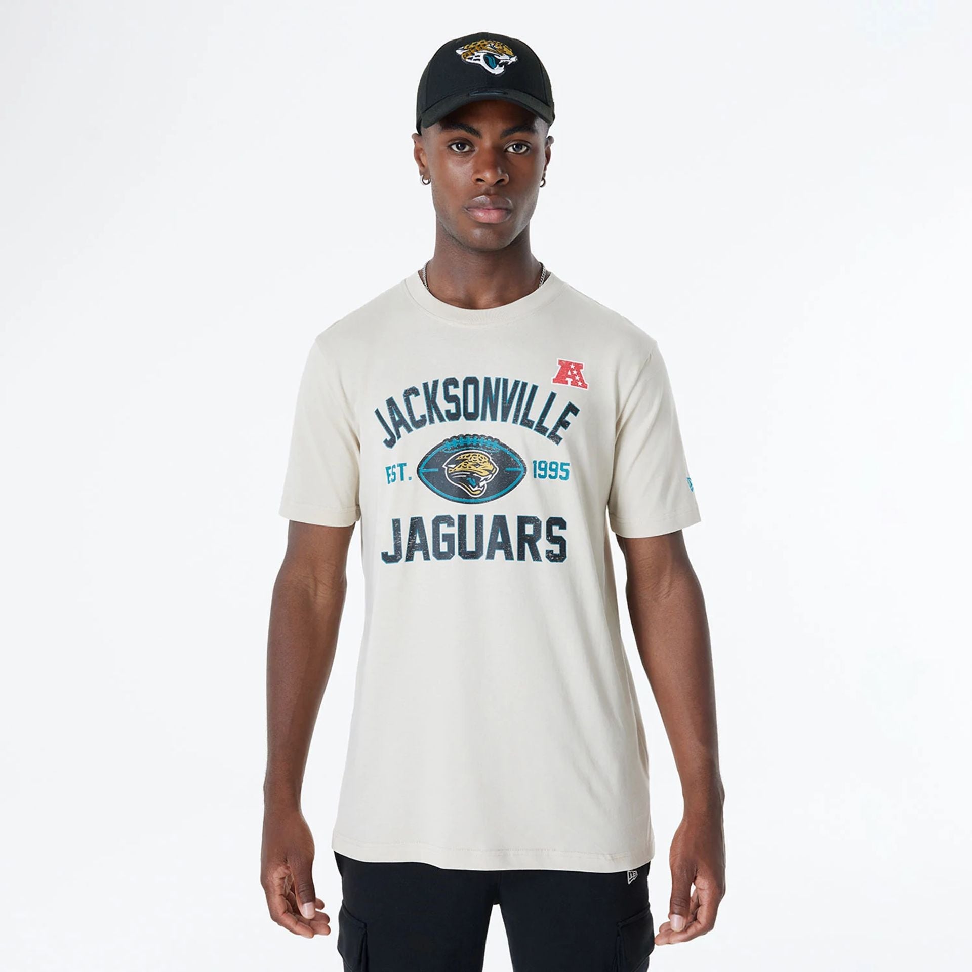 The Male model is wearing Jacksonville Jaguars NFL 3rd Down Historic Light Beige T-Shirt 1