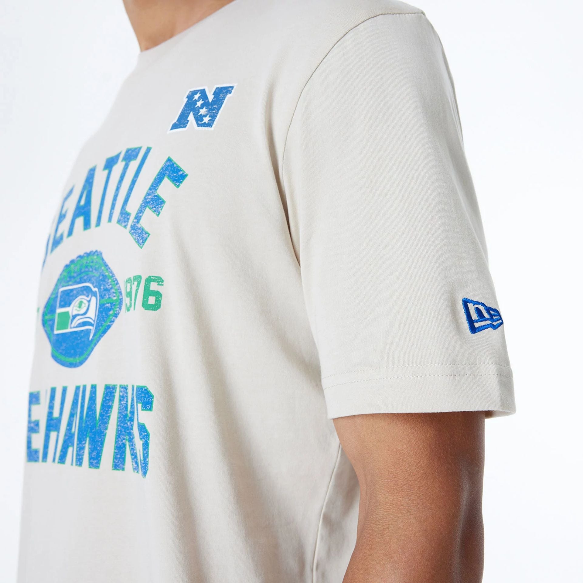 The Male model is wearing Seattle Seahawks NFL 3rd Down Historic Light Beige T-Shirt  4