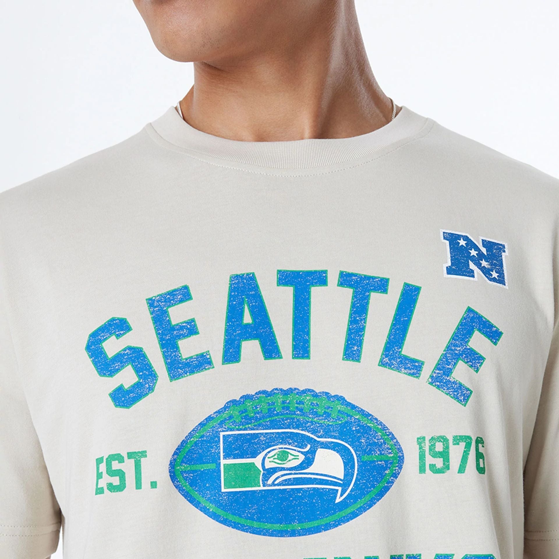 The Male model is wearing Seattle Seahawks NFL 3rd Down Historic Light Beige T-Shirt  6