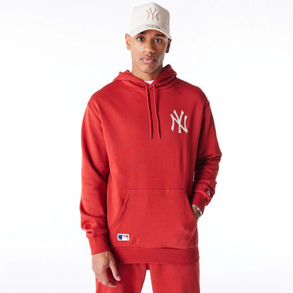 The Male model is wearing New York Yankees League Essential Red Oversized Pullover Hoodie 2