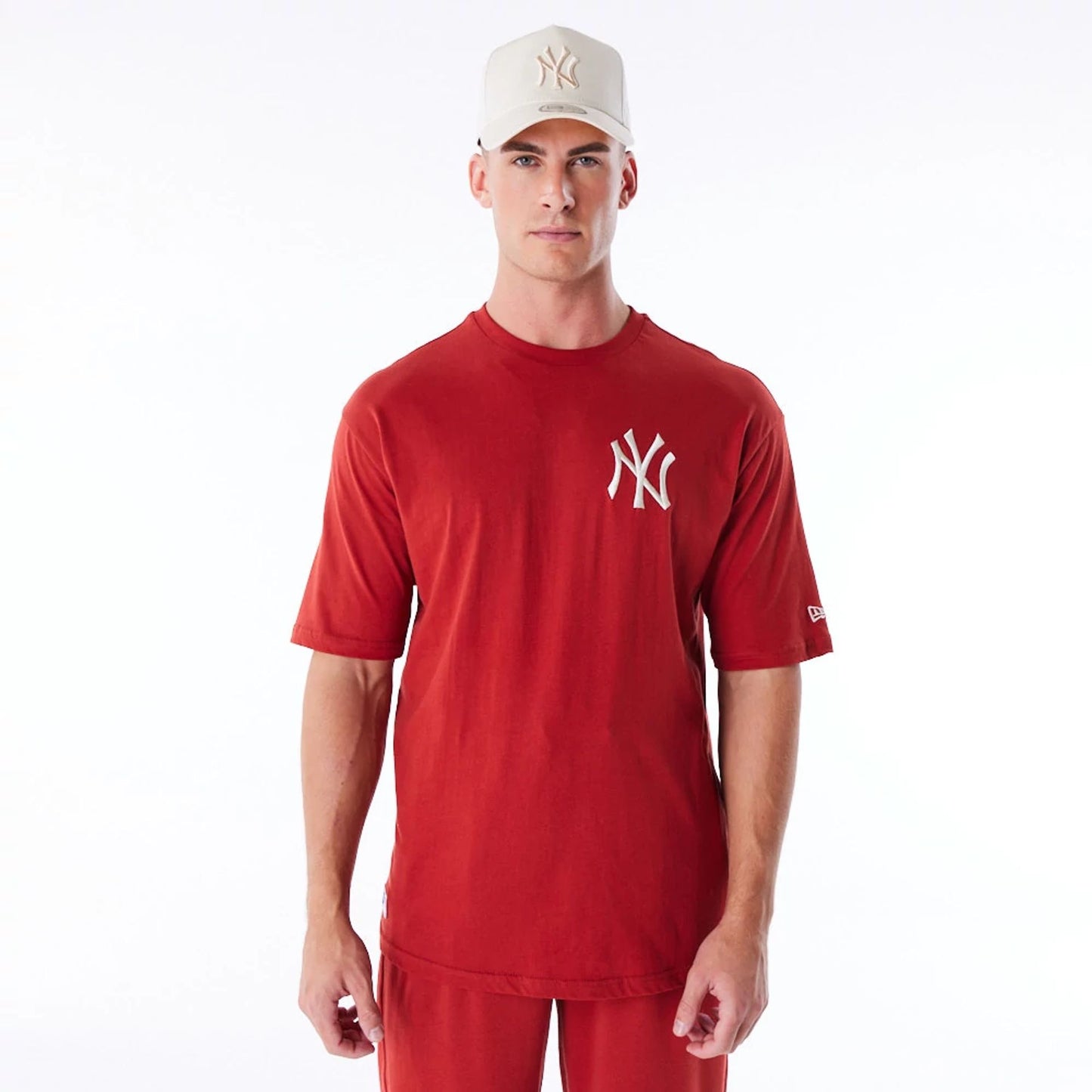 The Male model is wearing New York Yankees League Essential Red Oversized T-Shirt 2