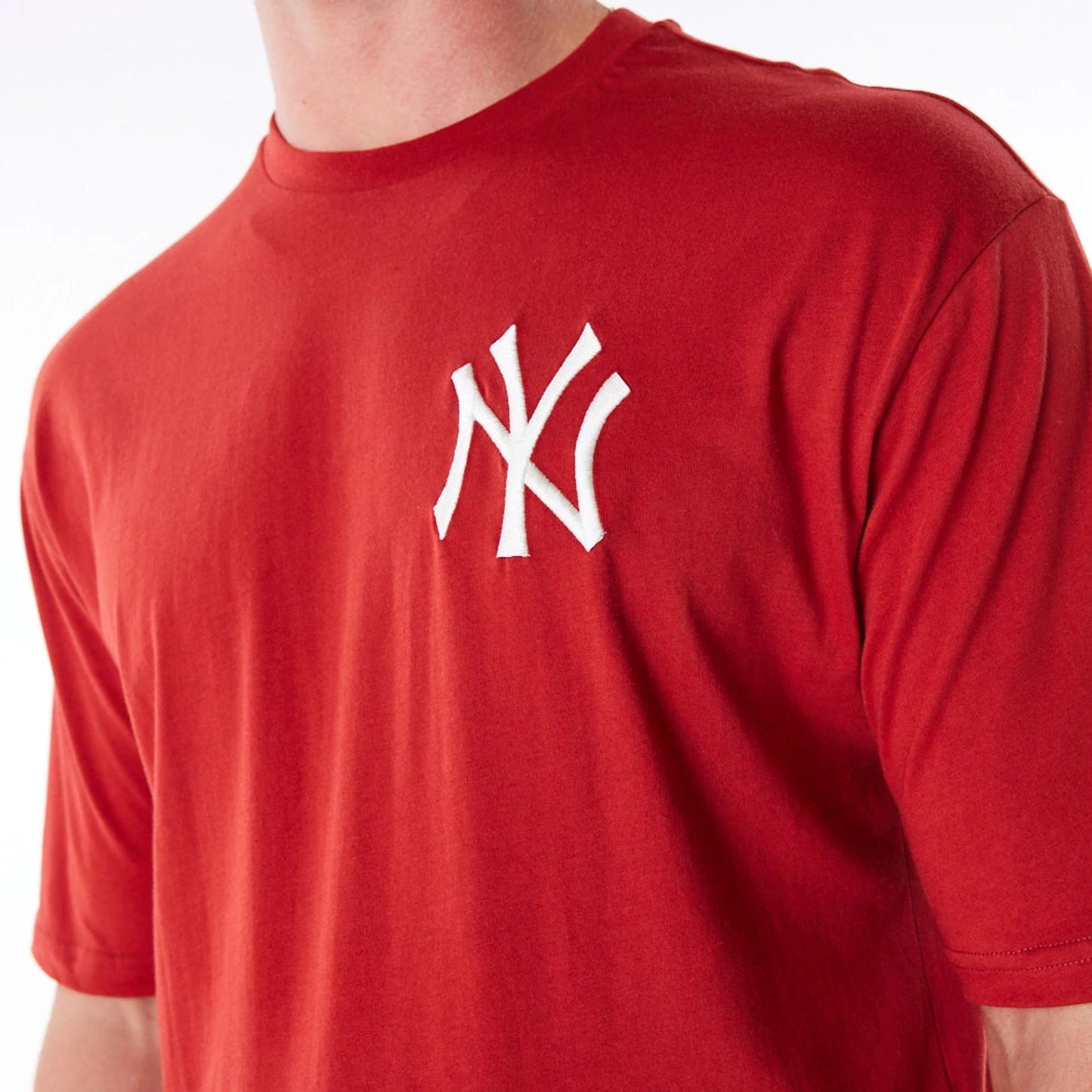 The Male model is wearing New York Yankees League Essential Red Oversized T-Shirt 6