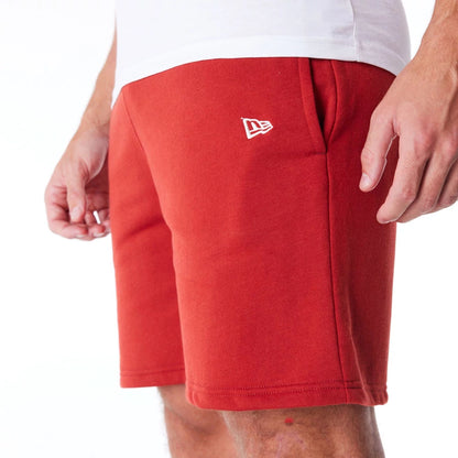 The Male model is wearing New York Yankees League Essential Red Shorts 4