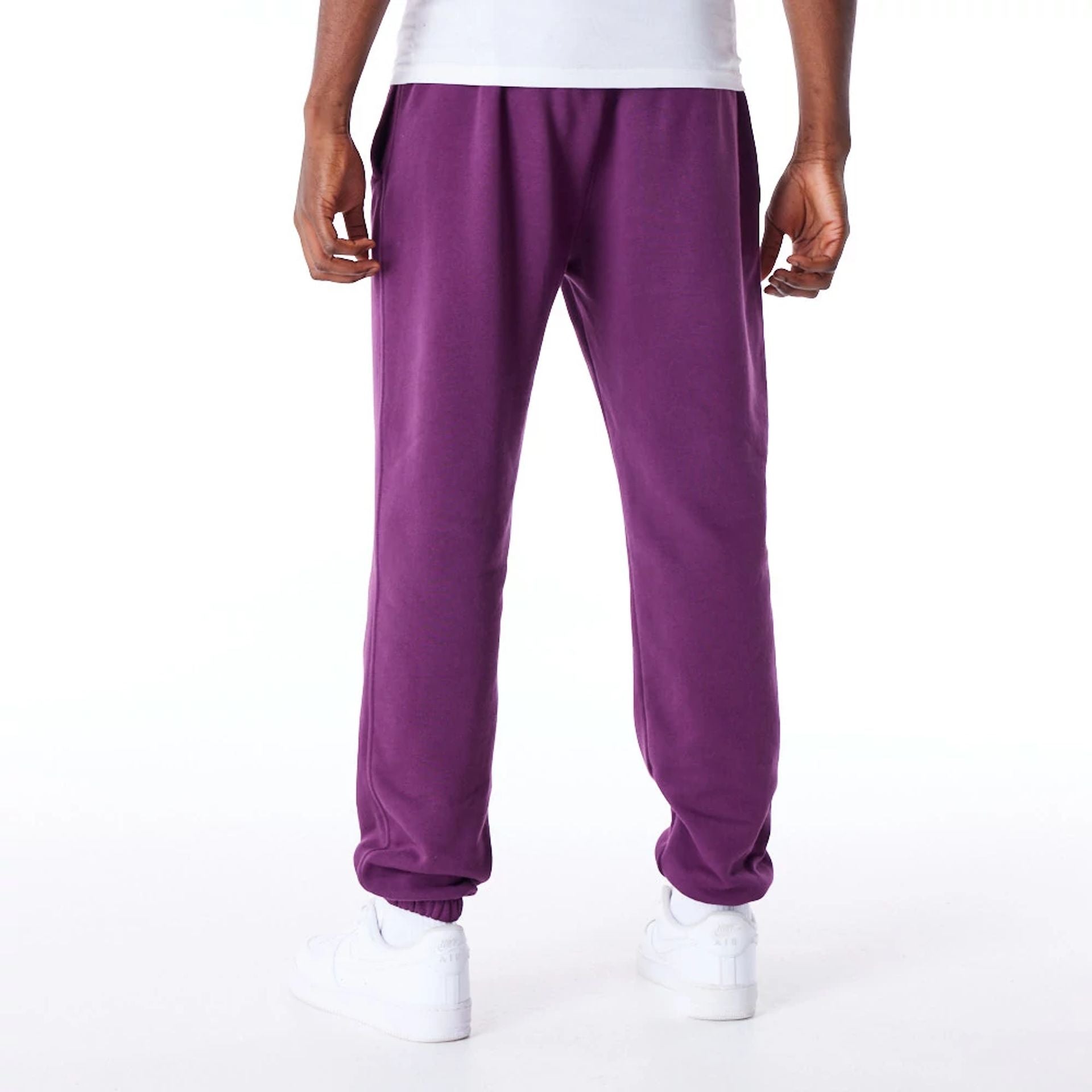 The Male model is wearing LA Dodgers League Essential Dark Purple Fleece Joggers 9