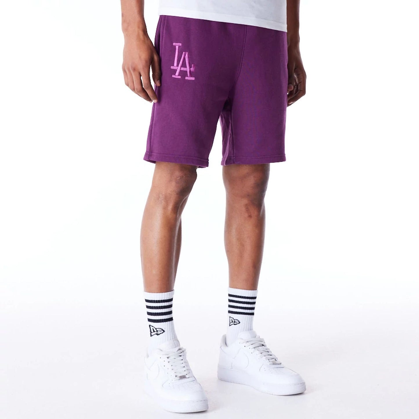 The Male model is wearing LA Dodgers League Essential Dark Purple Shorts 1