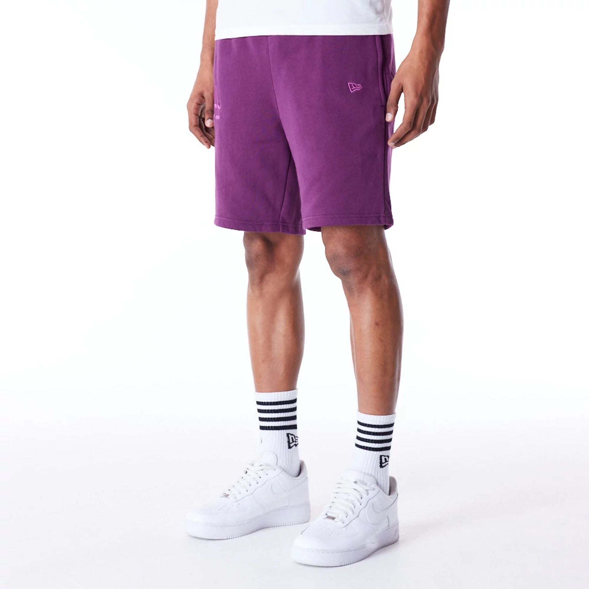 The Male model is wearing LA Dodgers League Essential Dark Purple Shorts 2