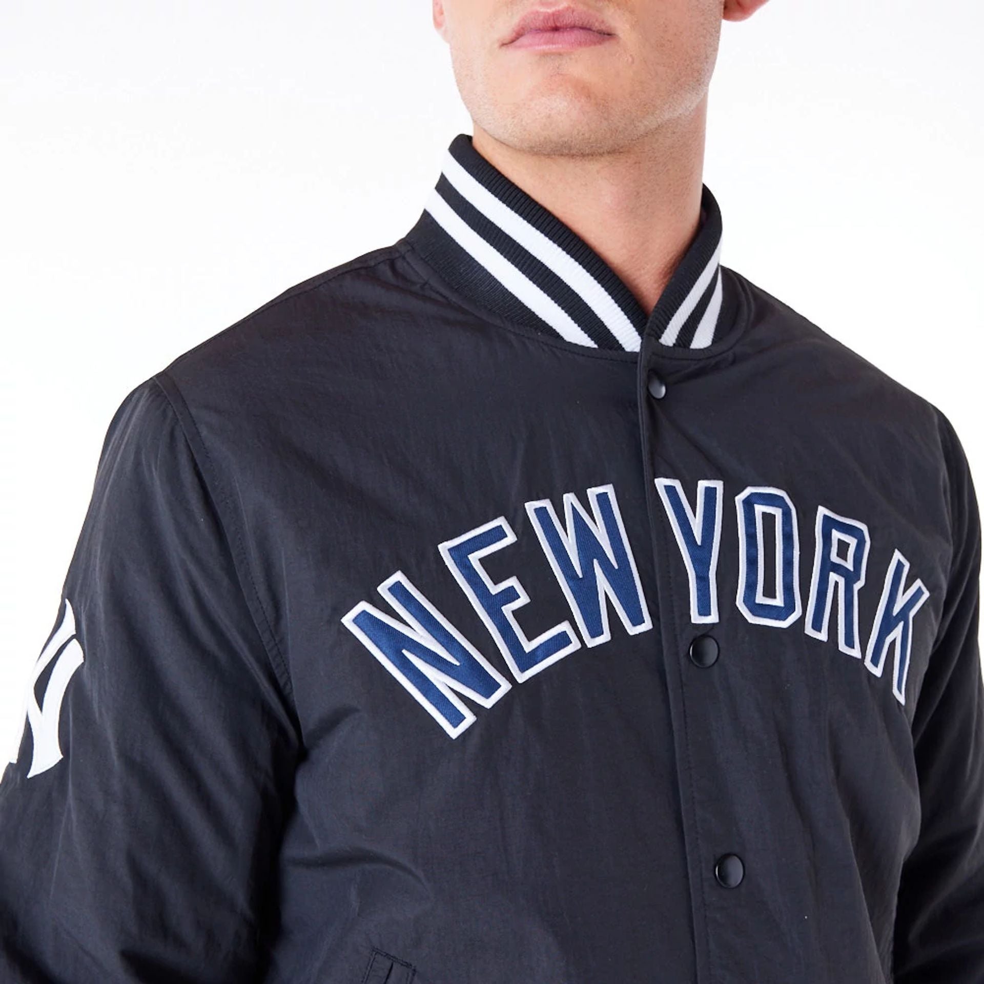 The Male model is wearing New York Yankees MLB Wordmark Black Bomber Jacket 2