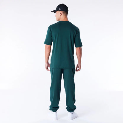 The Male model is wearing Chicago White Sox League Essential Dark Green Oversized T-Shirt 9