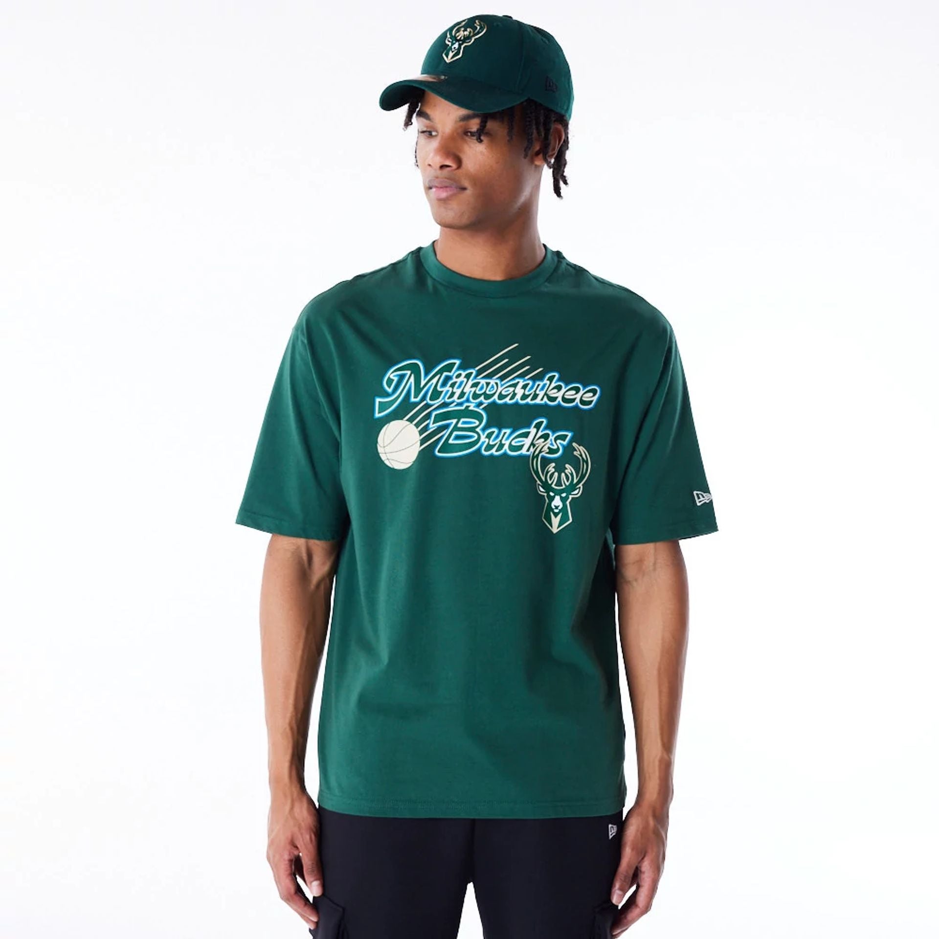 The Male model is wearing Milwaukee Bucks NBA Script Dark Green Oversized T-Shirt 1