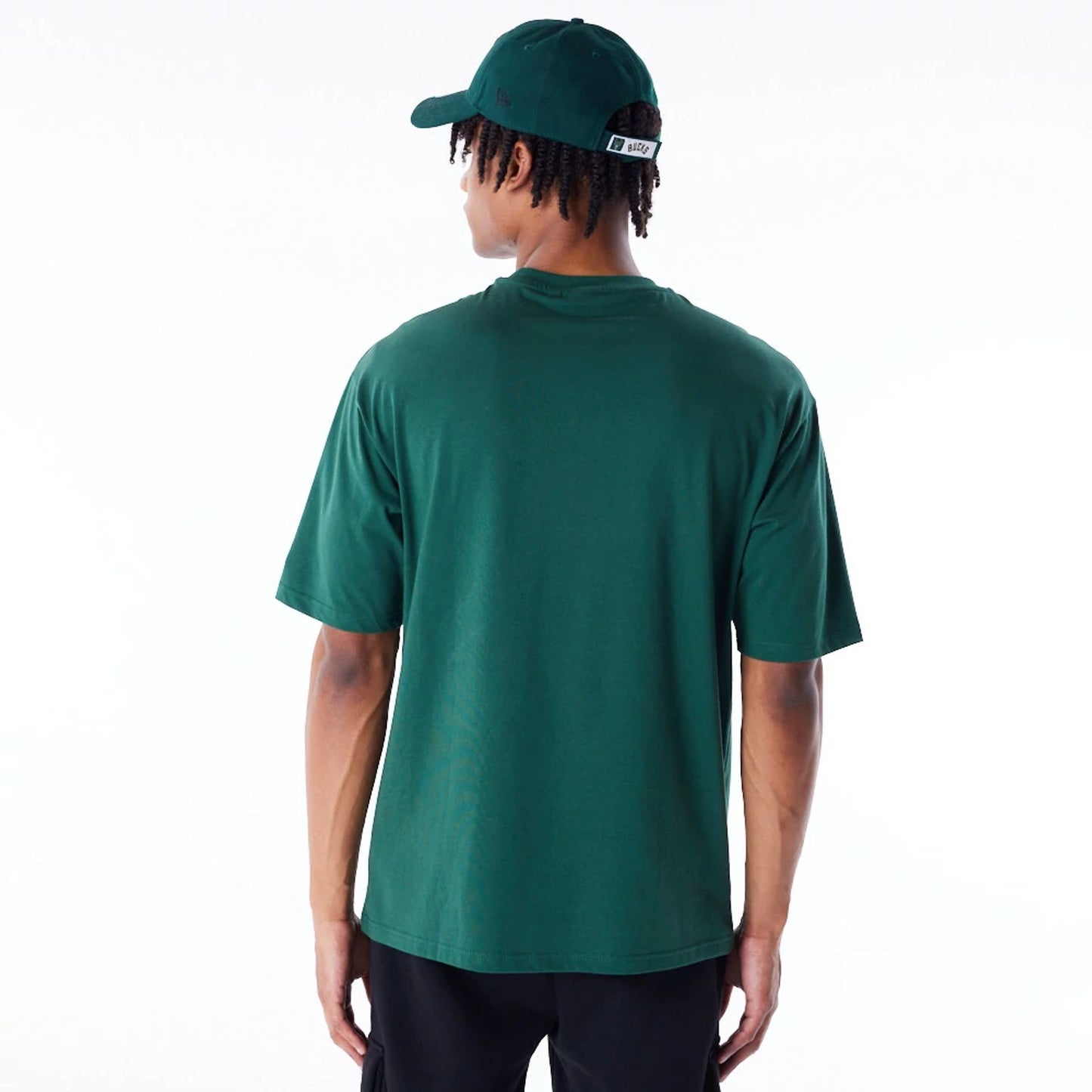 The Male model is wearing Milwaukee Bucks NBA Script Dark Green Oversized T-Shirt 3