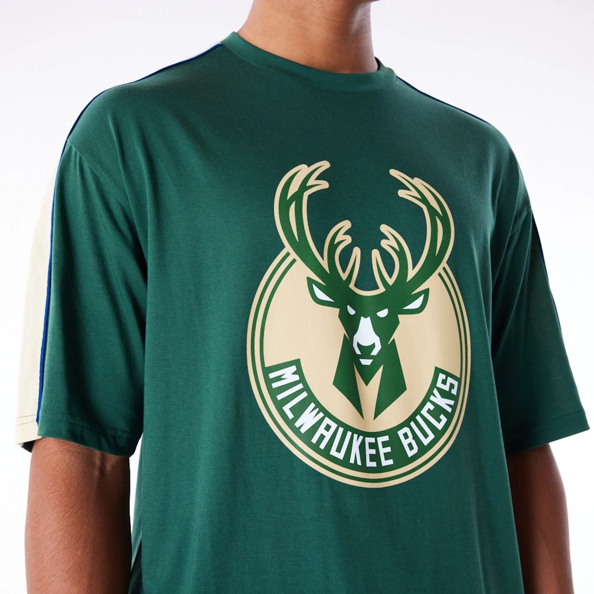 The Male model is wearing Milwaukee Bucks NBA Panel Dark Green Oversized T-Shirt 2