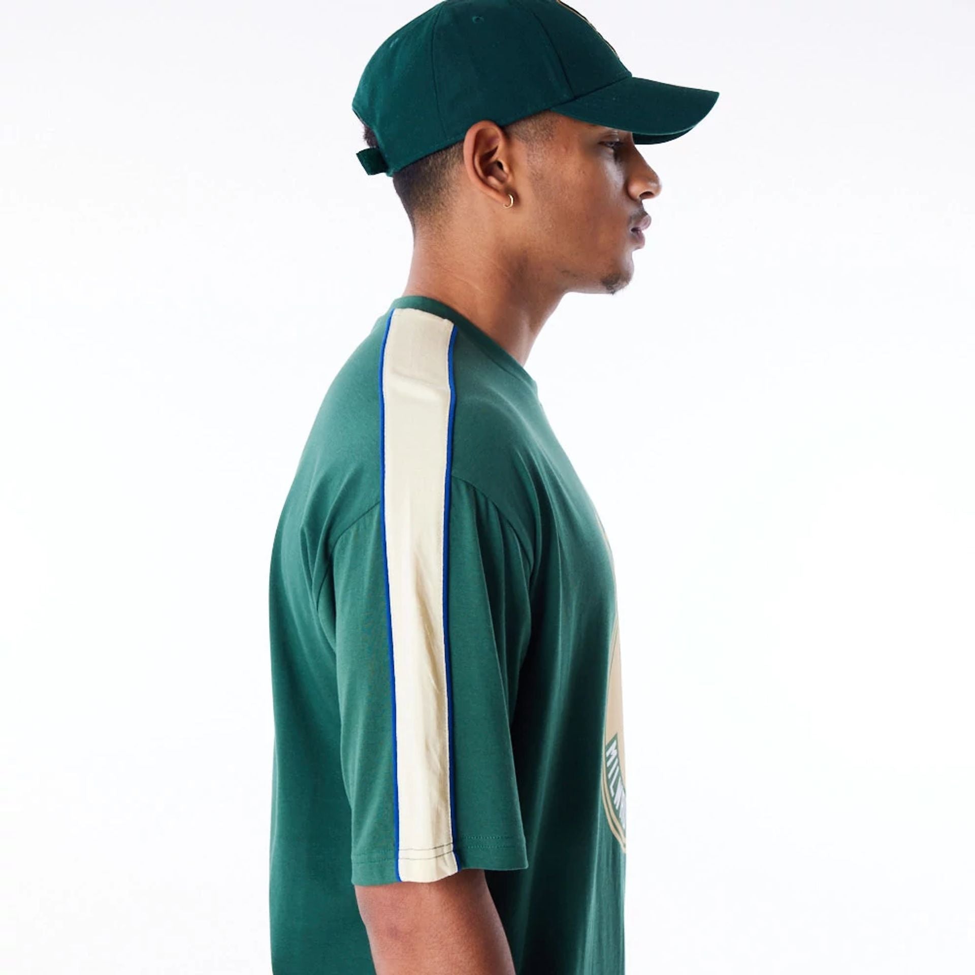 The Male model is wearing Milwaukee Bucks NBA Panel Dark Green Oversized T-Shirt 5